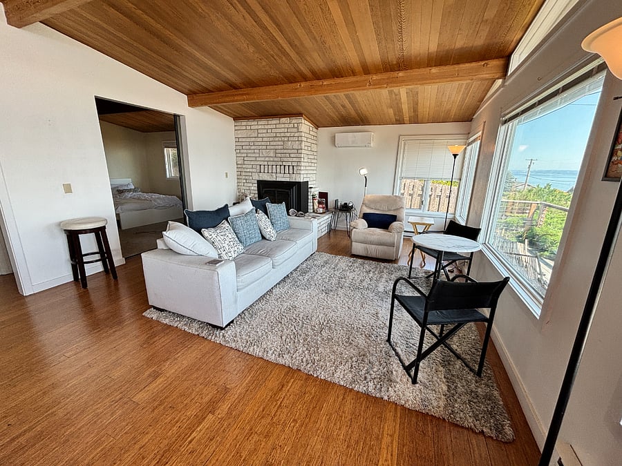 Living room with master bedroom entry behind.   