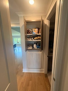 Available shelving adjacent to bathroom