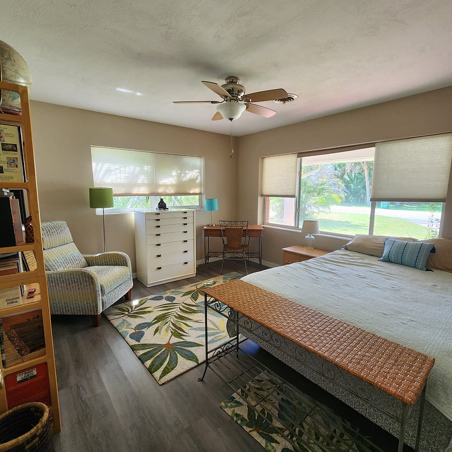 whole 150 square foot bedroom, view with ceiling fan