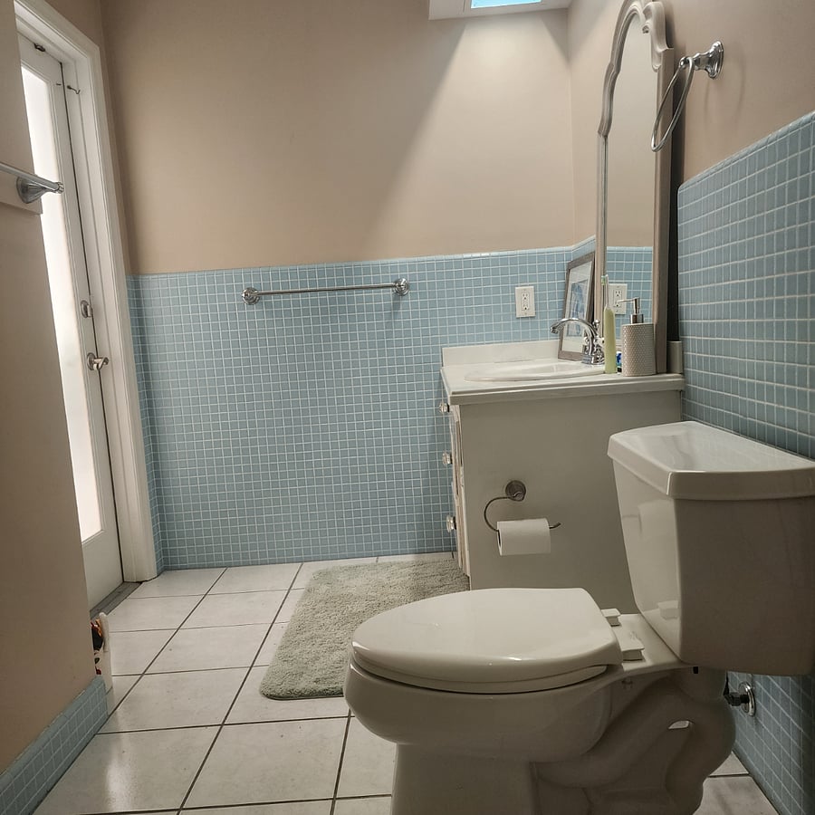 another view of bathroom sink & toilet