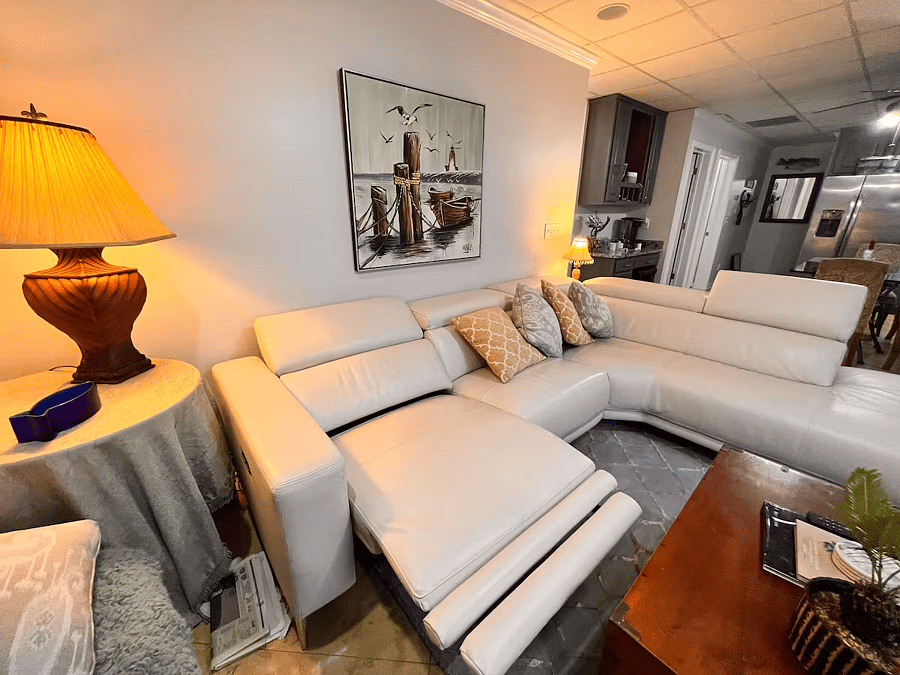High-end leather sofa with 2 built in recliners and adjustable head rests.
