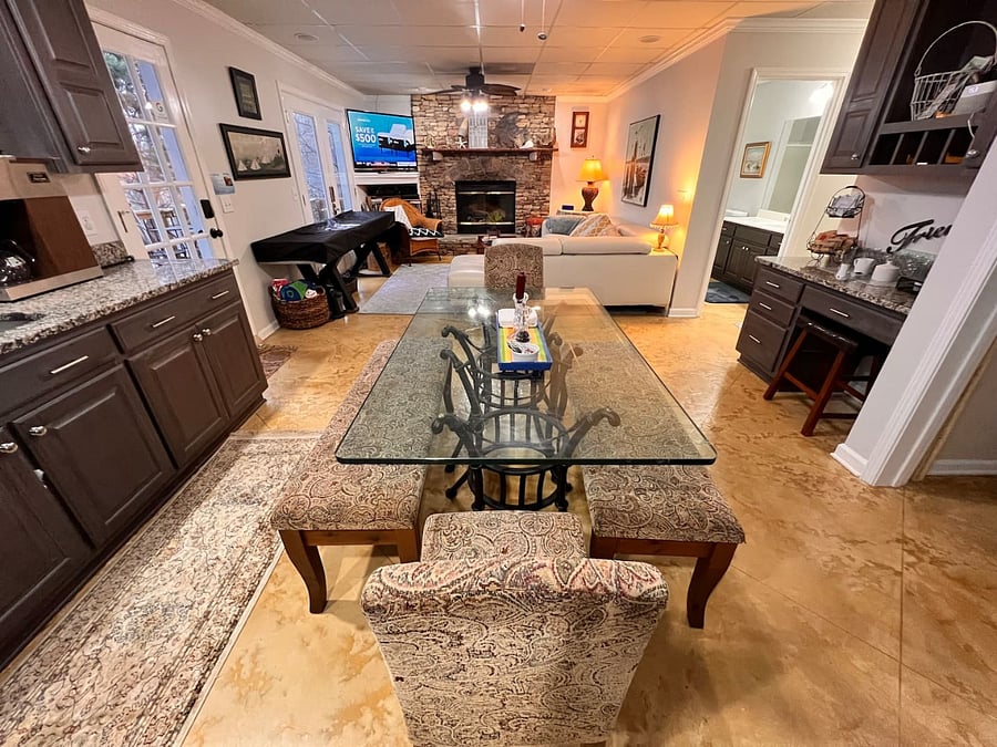 Kitchen and living area with a large flat screen TV