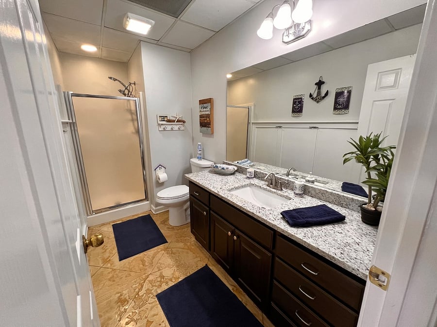 2nd bath with granite counter top and walk-in shower.