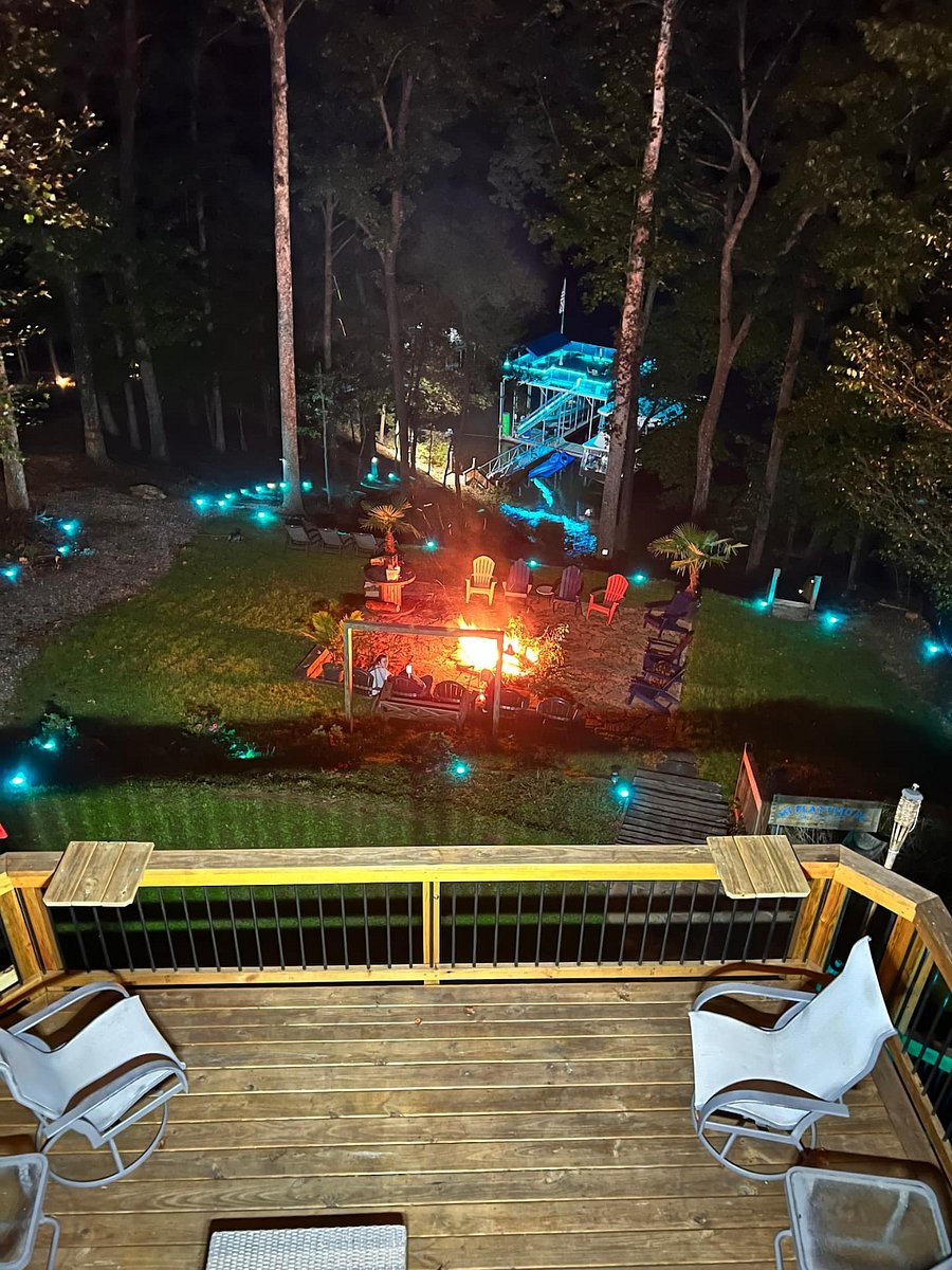 Backyard and dock is beautifully light-scaped