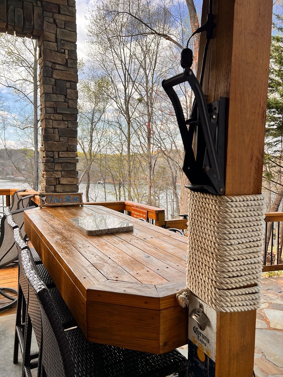 Patio bar tat seats 6 for outdoor dining overlooking the lake.