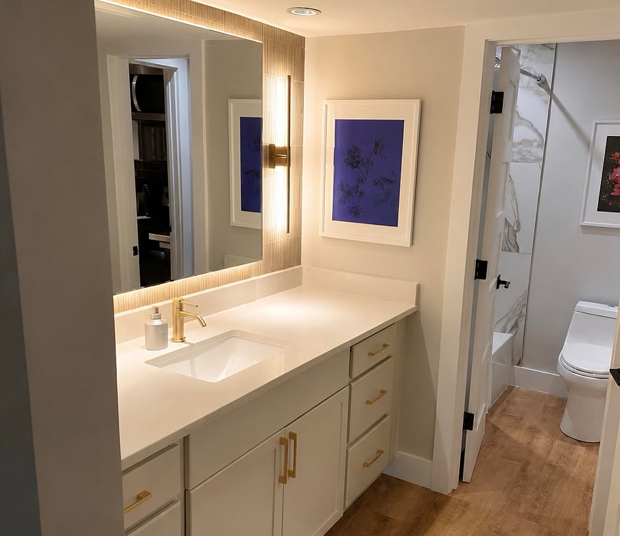 Spa-inspired bath with floating backlit mirror, designer sconces, plush luxury towels, walk-in closet, and full size linen closet