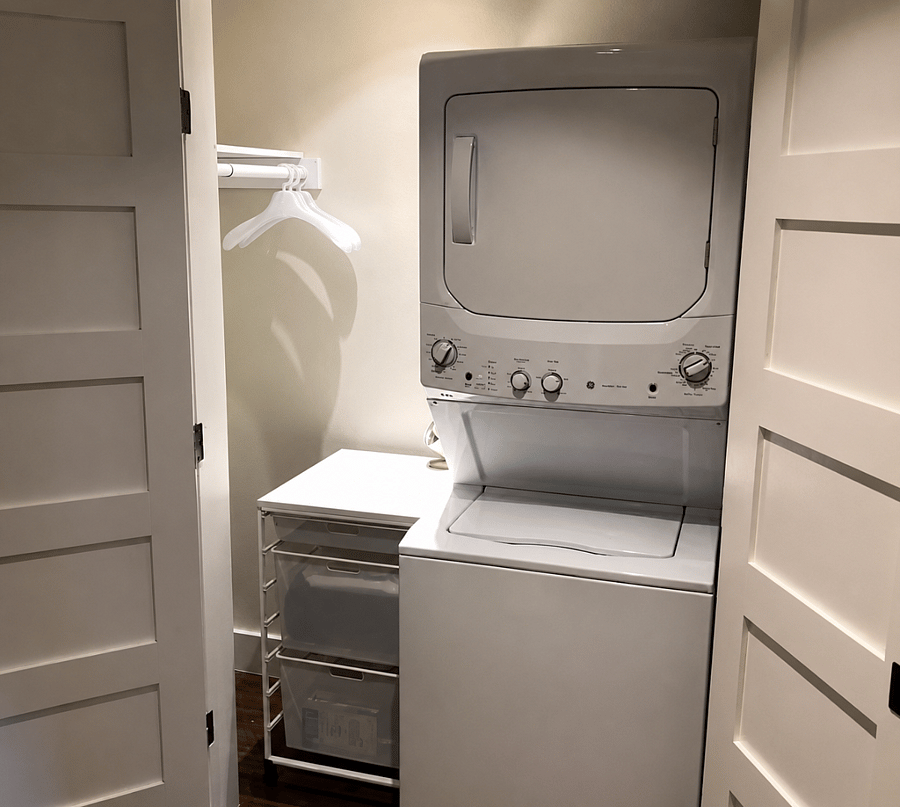 Dedicated laundry closet with full size washer/dryer, hang dry and additional storage - perfect for long term stays