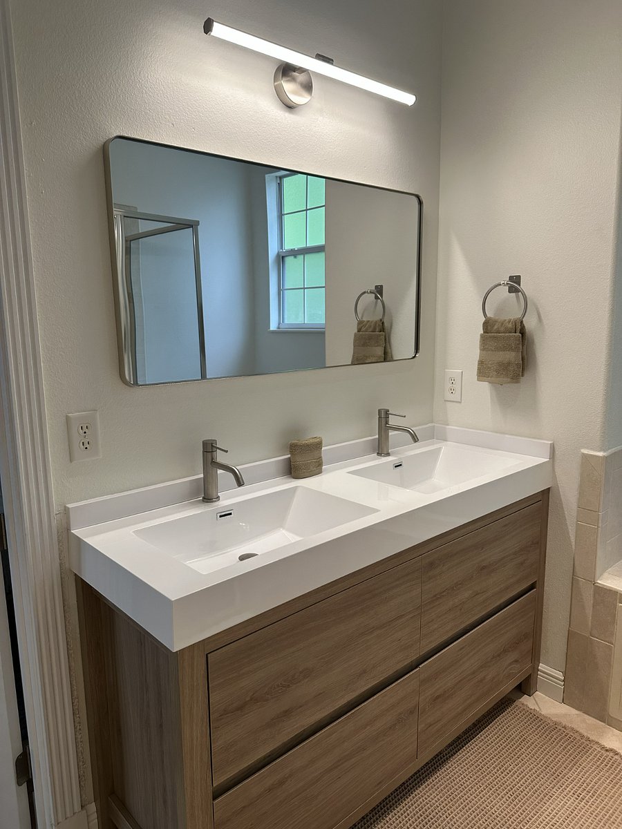 Primary bathroom with dual-sink vanity, walk-in shower, jacuzzi tub, and linen closet