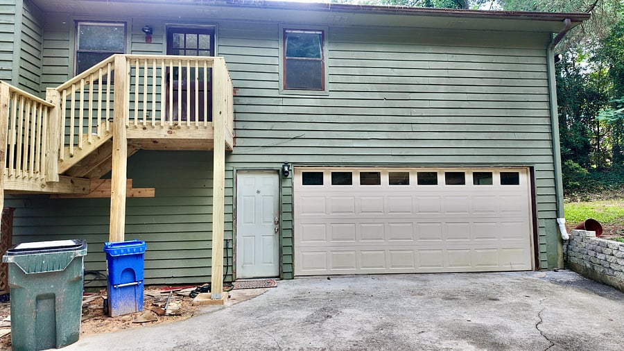 Laundry room access door next to garage 