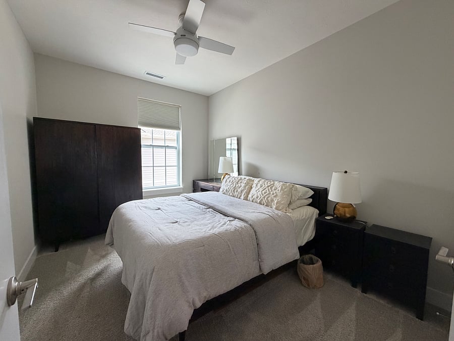 Well appointed guest bedroom with dressing table, attached coset, stand alone wardrobe and recently installed Hunter ceiling fan.