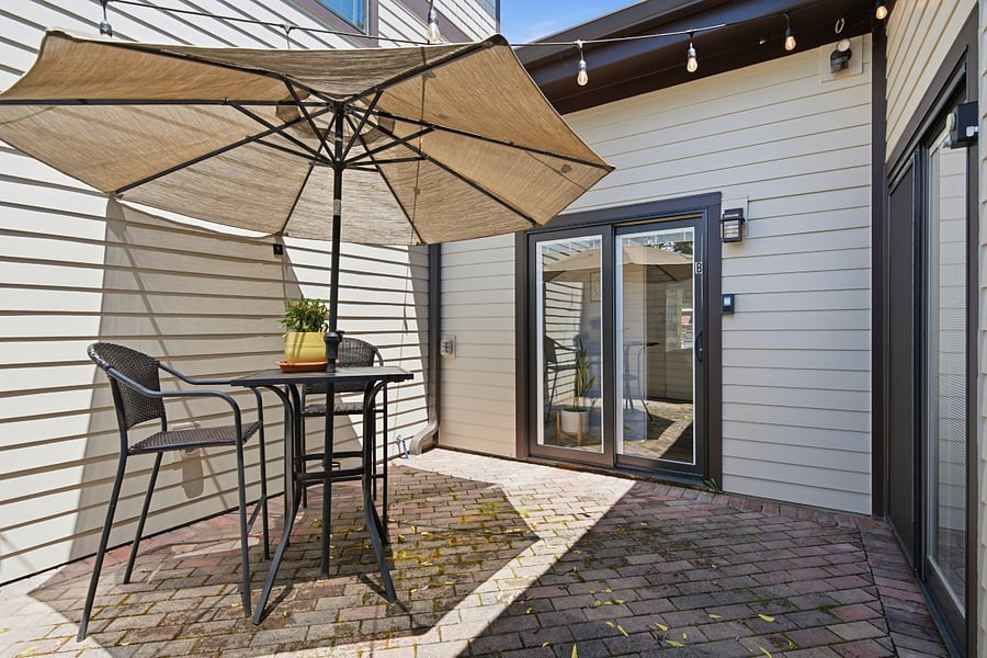 Secure courtyard, bistro table, string lights