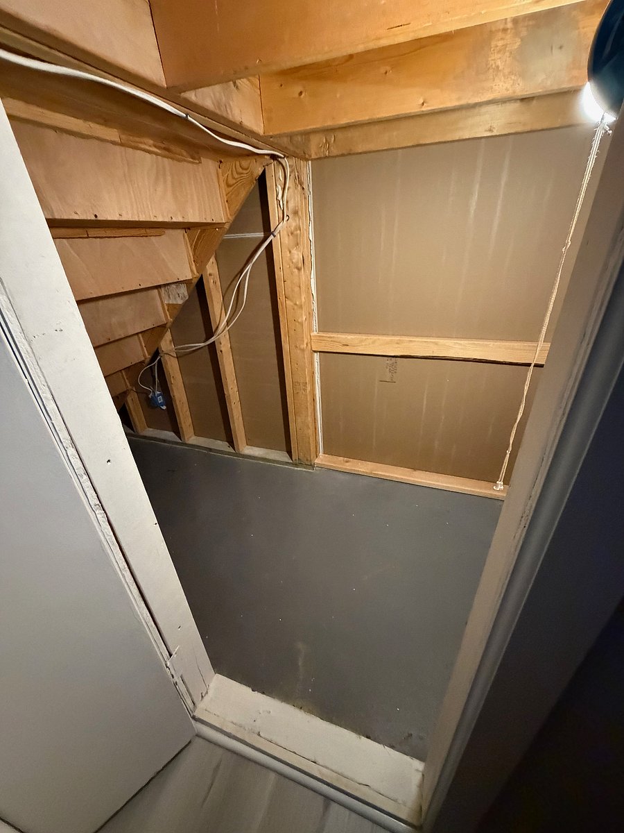 Under the stair storage and light area