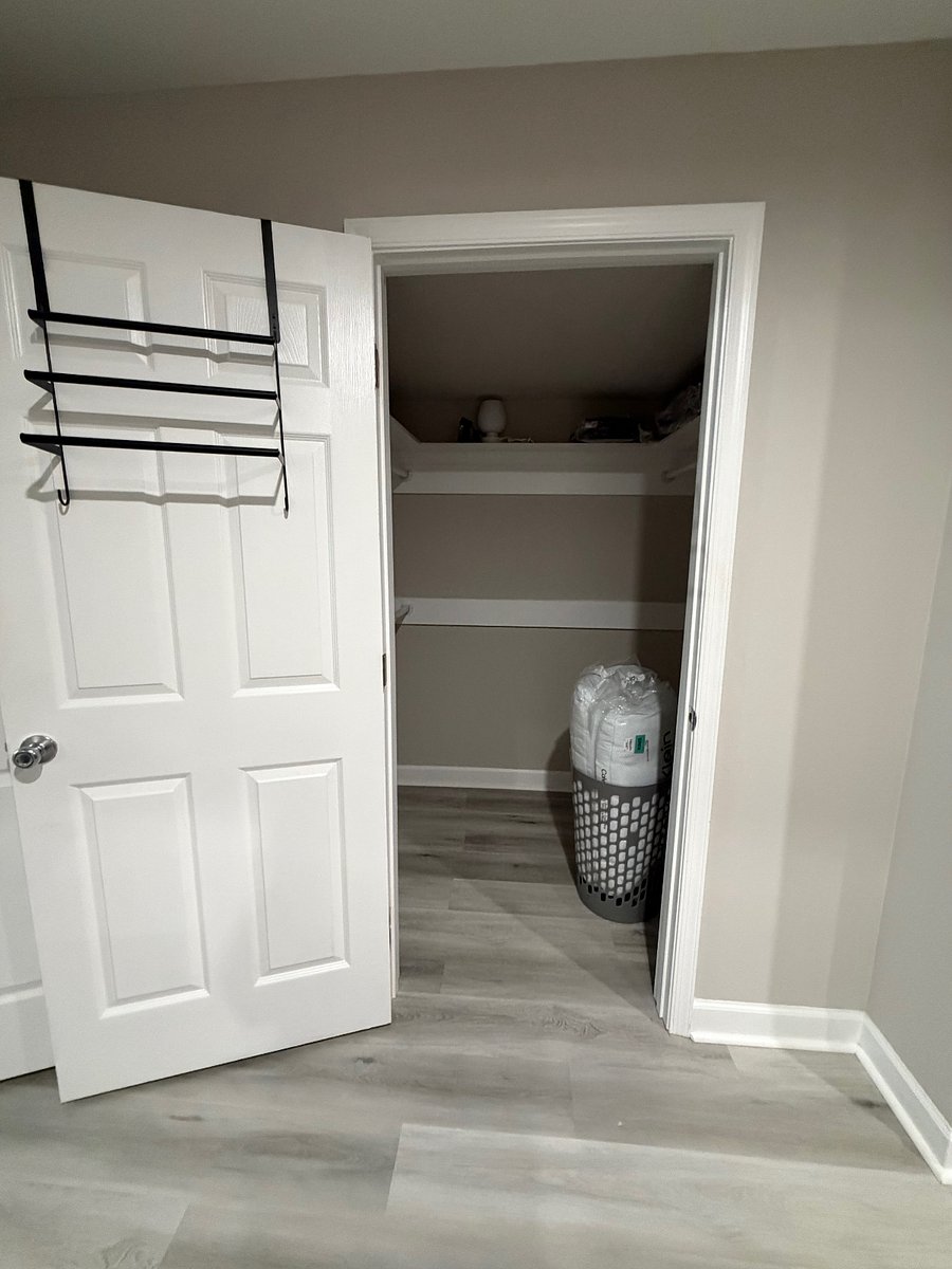 King size bedroom closet; clothes hamper; hangers