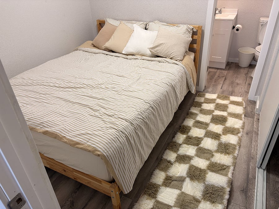 Queen size bed with new bedding
