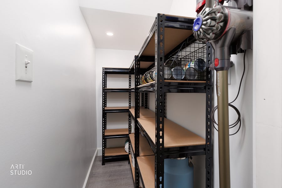 A flexible storage room that works as a pantry, gear closet, or overflow for anything extra you bring, with a provided Dyson vacuum wall-mounted and always charged and ready.