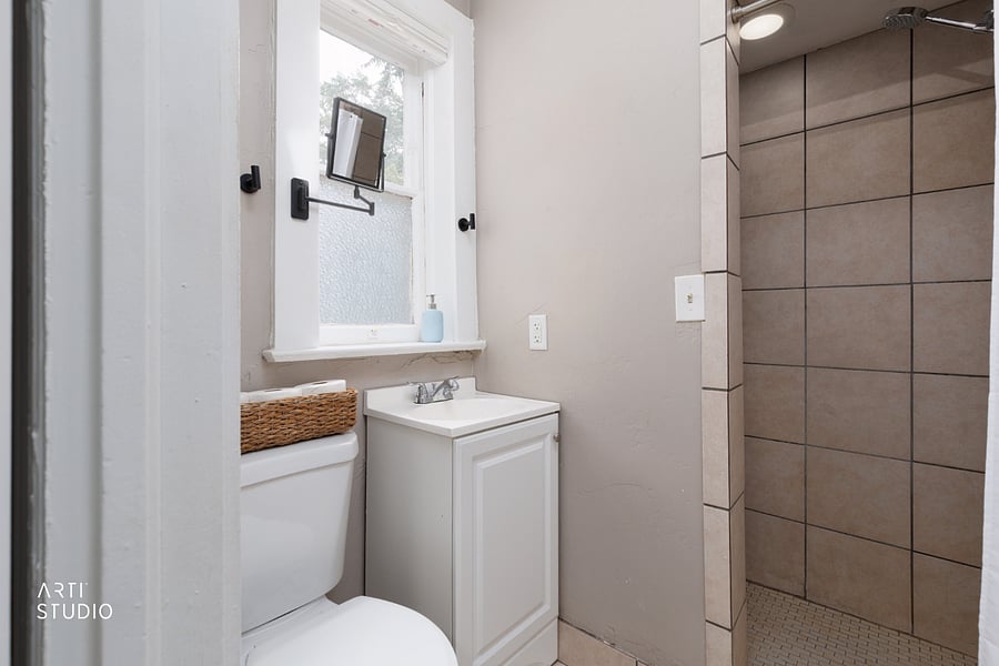 The primary bath centers on a large walk-in shower with room for two, plus a handheld sprayer that makes rinsing gear or washing little ones easy.