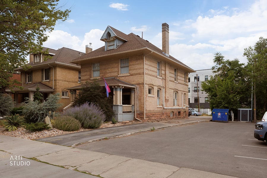 The drive leading to private parking at the back: two dedicated off-street spots for this unit, plus a shared guest spot for the house.