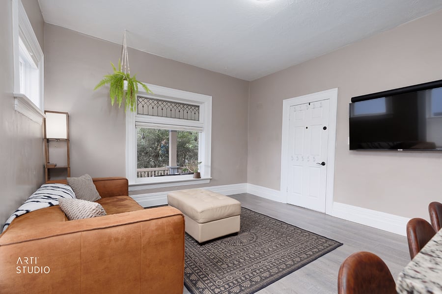 Looking from the kitchen into the living area, with a smart TV placed so it's visible from both, whether you're cooking or unwinding.