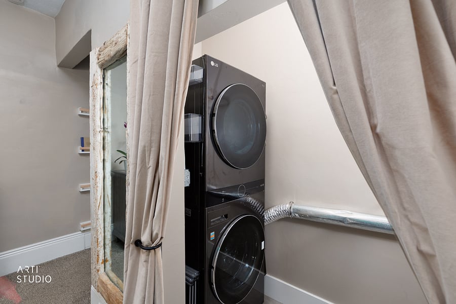 A close look at the in-unit washer and dryer just off the primary, so laundry stays private and you never hunt for quarters or a shared machine.