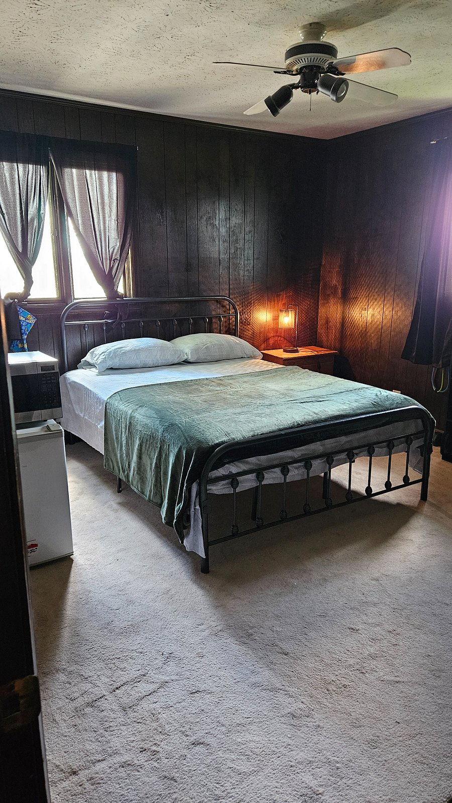 Third bedroom upstairs with a queen bed set, TV mounted, mini refrigerator. Shared bathroom. All rooms upstairs shared kitchen/dinning room/living room. Wifi with Roku and live streams program on every TV. $700 monthly...