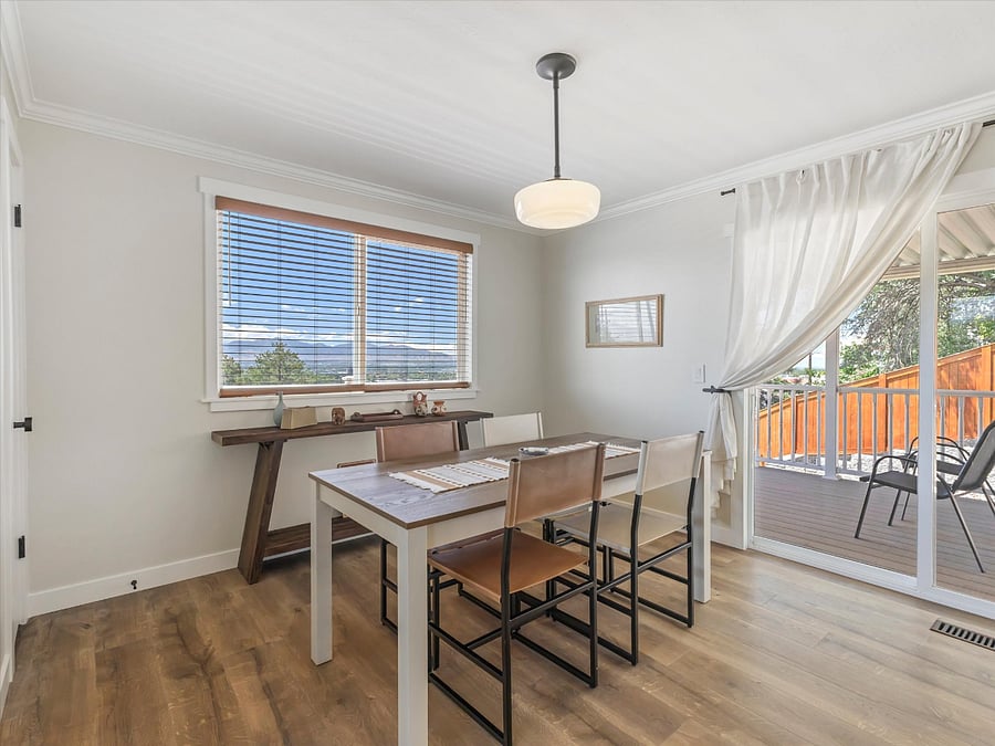 Dining room on other side of the kitchen. Great valley and sunset views out of the window and deck.