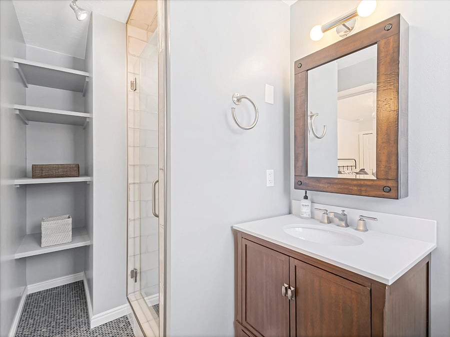 Master Bath with great shower and storage. 