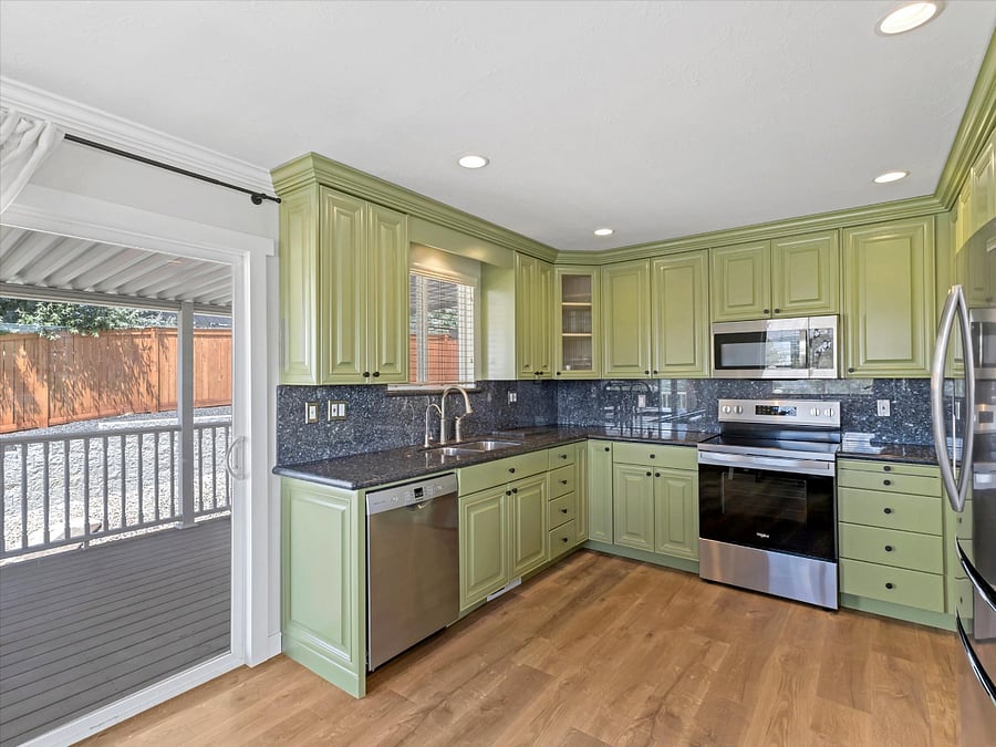 Newly remodelled Ktichen with black granite countertops facing Northeast. 