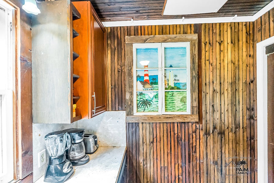 Some stories deserve to be preserved. Once an original 1932 window frame, this restored architectural piece now displays artwork inspired by Florida's coastal heritage, honoring the home's history while welcoming today's guests to The Prospect Retreat.