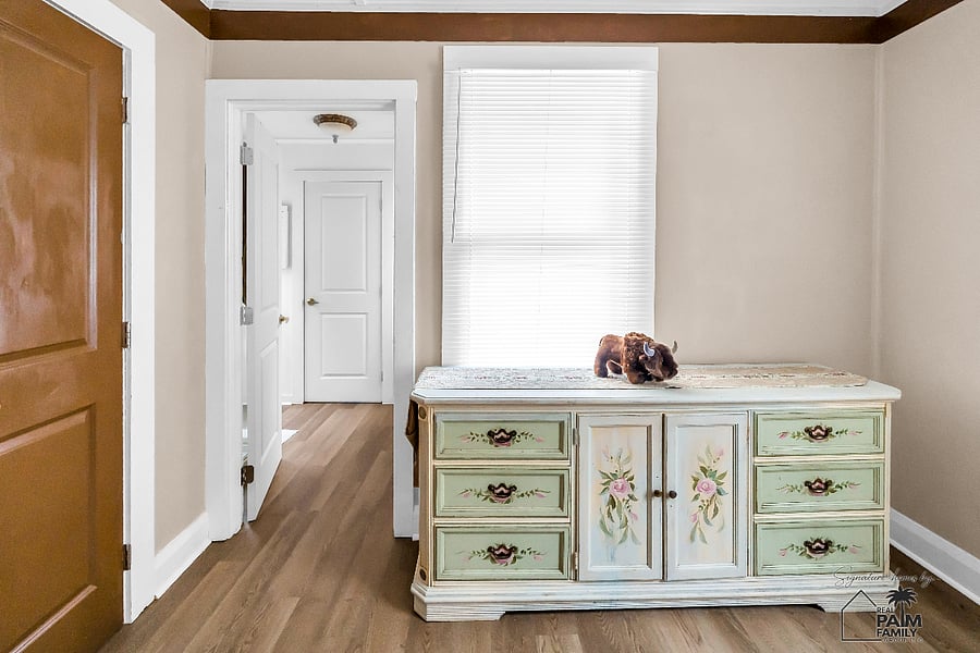 Beautiful homes are remembered for their details. This restored vintage dresser, with its delicate floral artwork and timeless craftsmanship, reflects the thoughtful character that defines every corner of The Prospect Retreat.