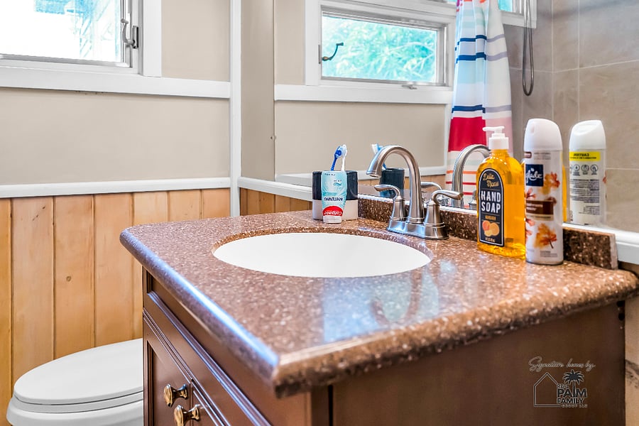Thoughtfully designed for everyday comfort, the second bathroom features a spacious vanity, generous natural light, and warm finishes that create a bright, welcoming space for your daily routine at The Prospect Retreat.