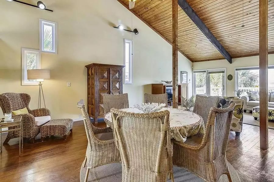 Dining table and comfy corner nook with the living room in the background