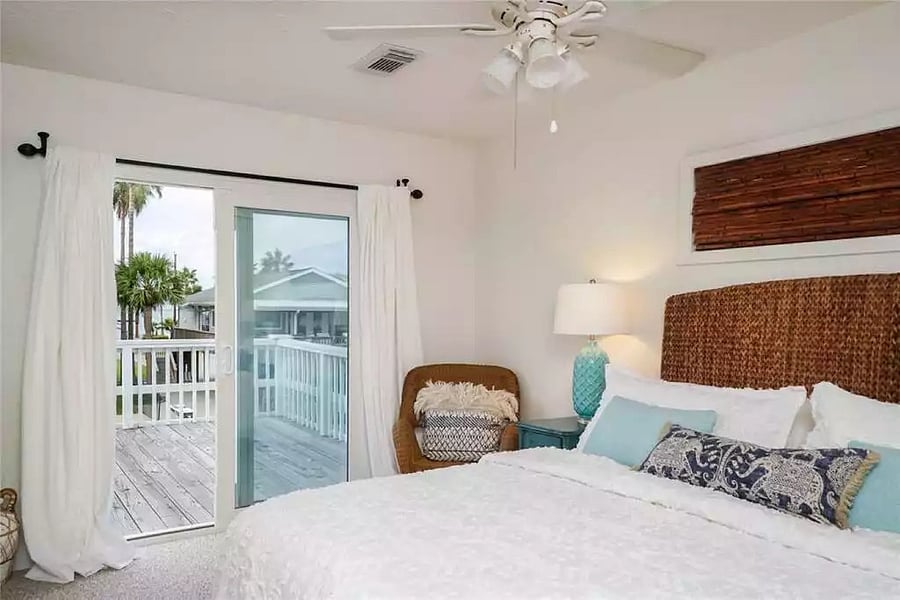 Master bedroom has a sliding glass door to the back deck