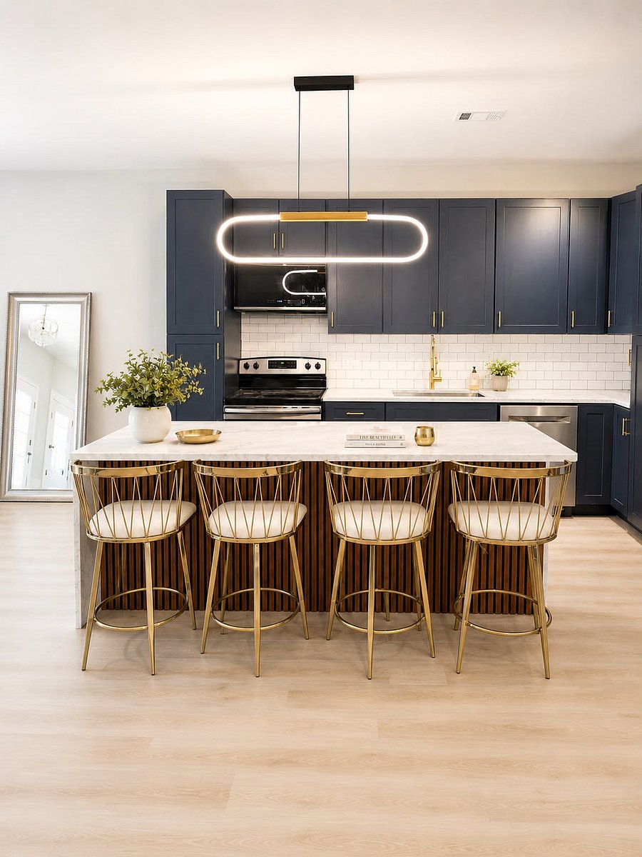 Full-size fridge, gas range, counter space for actual meal prep and a waterfall marble island with seating for four cook a real meal or just grab your coffee before heading out the door.