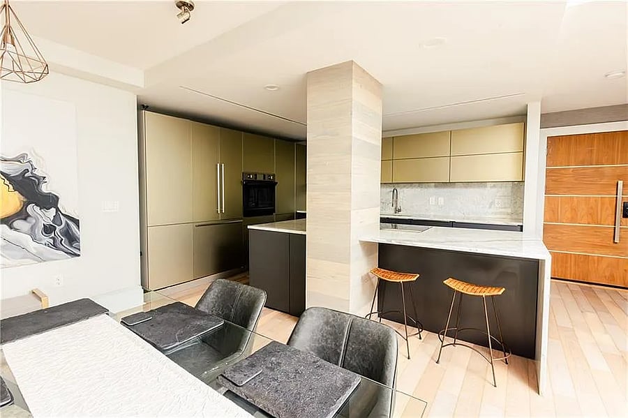 Fully equipped kitchen with dining space for work, meals, or entertaining.
