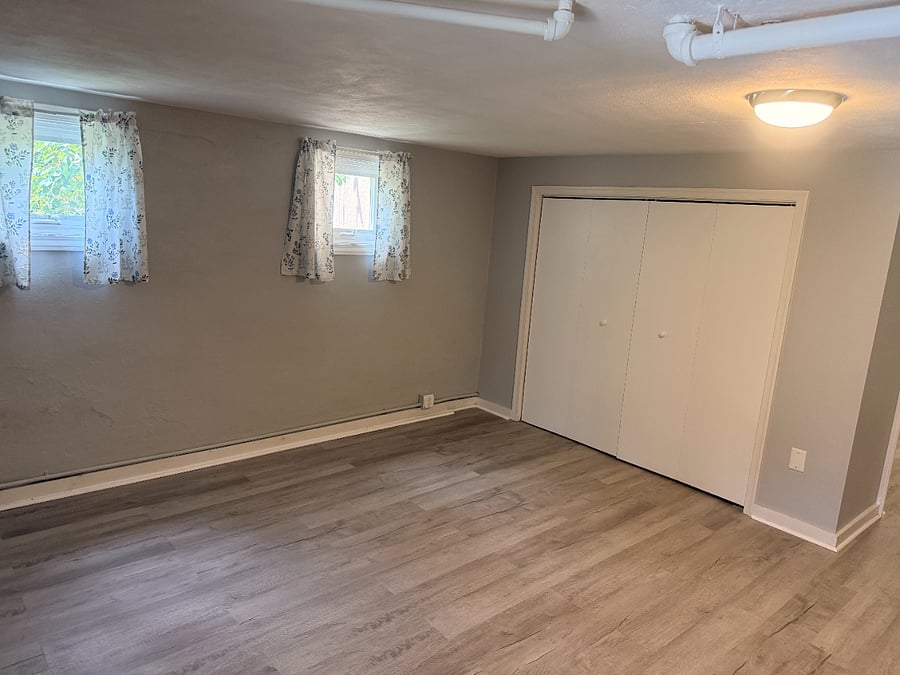 Wall to wall closet, and crank out windows.  (New Queen bed, desk, end table, and floor lamp will be provided as of (9/15/26.)