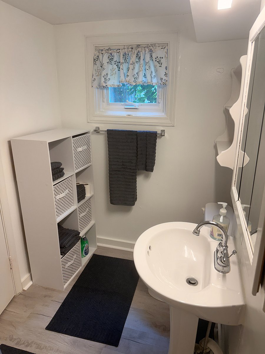 Bathroom storage, shelving, linens provided. 