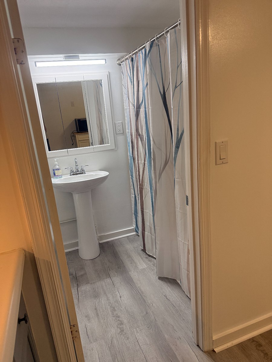 Full bath with tub, large medicine cabinet, shelves, and cubic storageSt.
