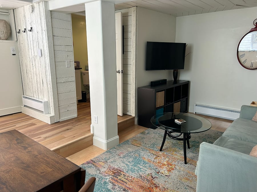 Living room area shows location of bathroom 