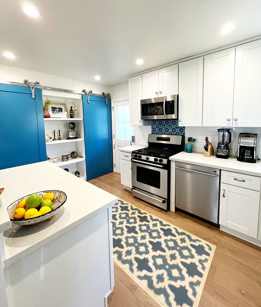 Washer & Dryer behind sliding door on left. Pantry on right.