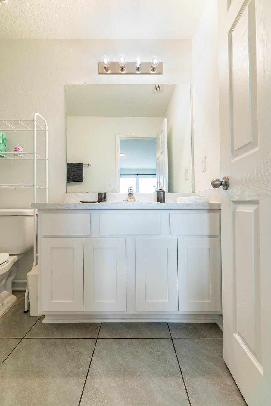 Master bathroom with vanity, shower, and tub.