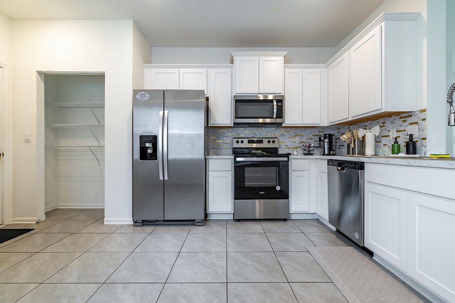 Fully equipped kitchen with stainless steel appliances.