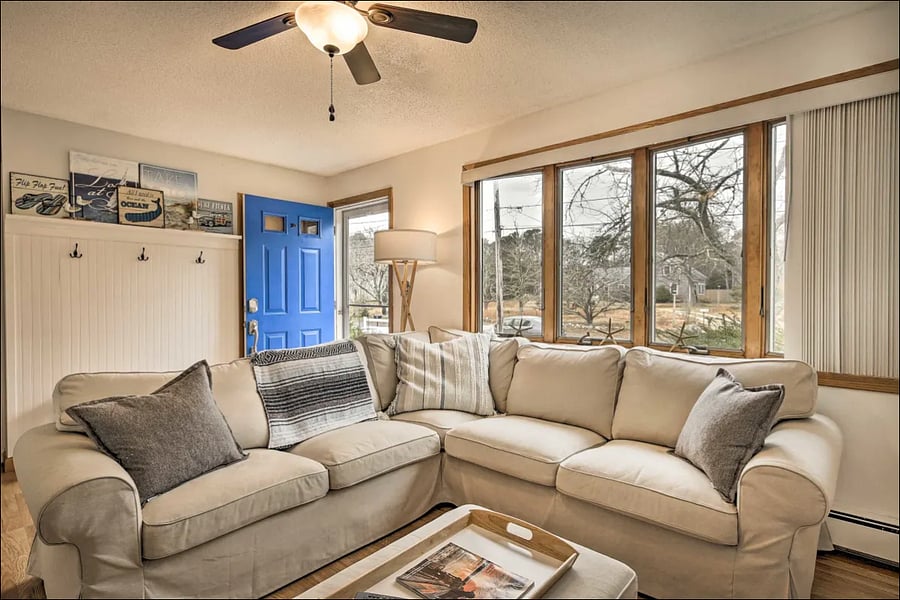 Living room looking out front window and door