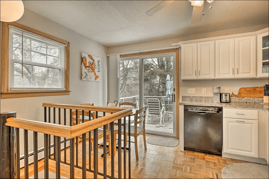 Kitchen with spiral stair to basement
