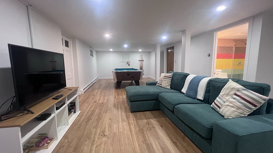 Fully renovated basement with smart TV, pool table