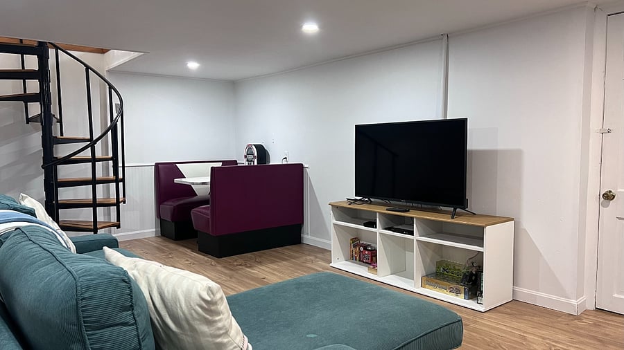 Basement couch, TV, and dinette