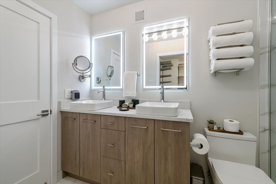 Primary Bathroom with walk in shower, dual vanity.