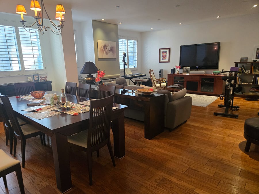 Dining and living room area. Wood floors.