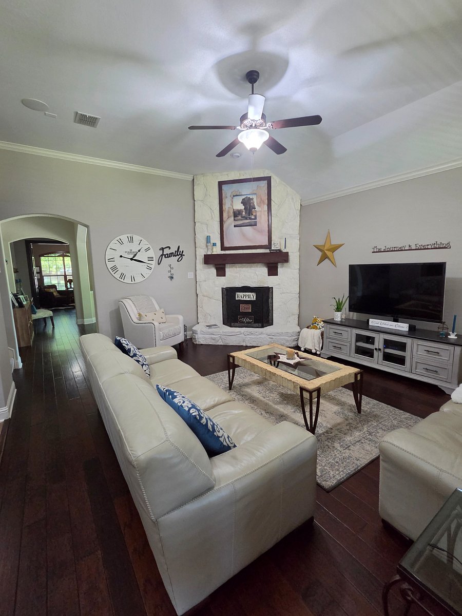 Common area with smart TV and relaxing setting.
