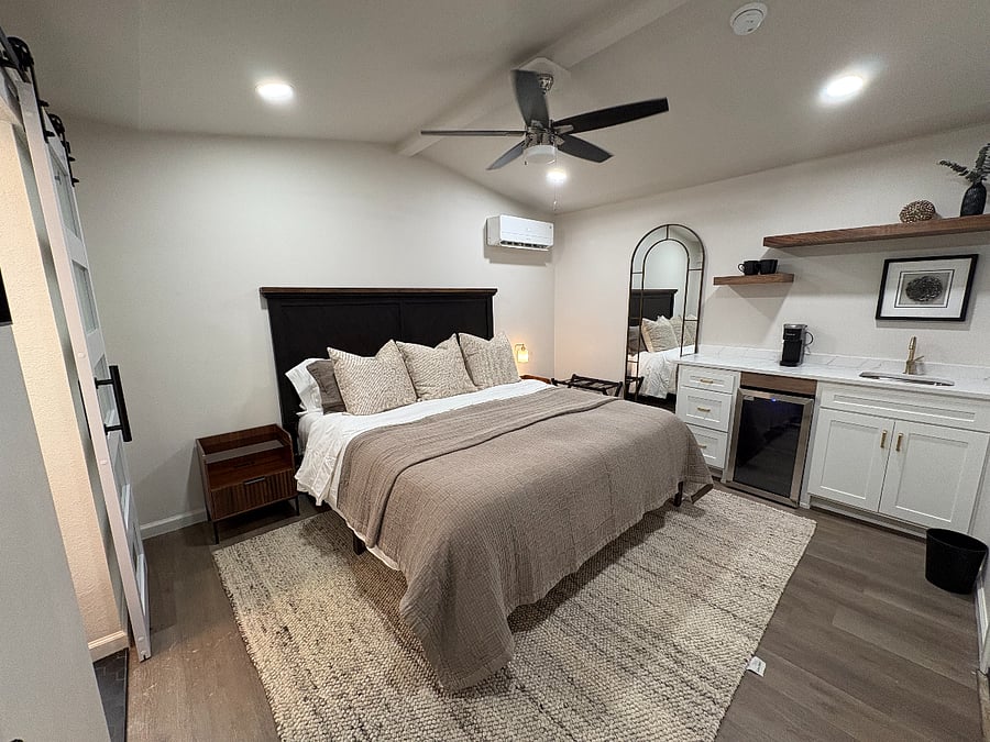 King size bedroom with its own private bathroom located detached from main house just steps from back door
