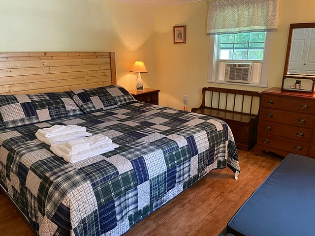 Larger bedroom with king-sized bed